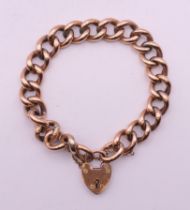 A 9 ct gold bracelet and padlock. 18 cm long. 18.8 grammes.