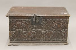 An 18th century carved oak Bible box. 60.5 cm wide.