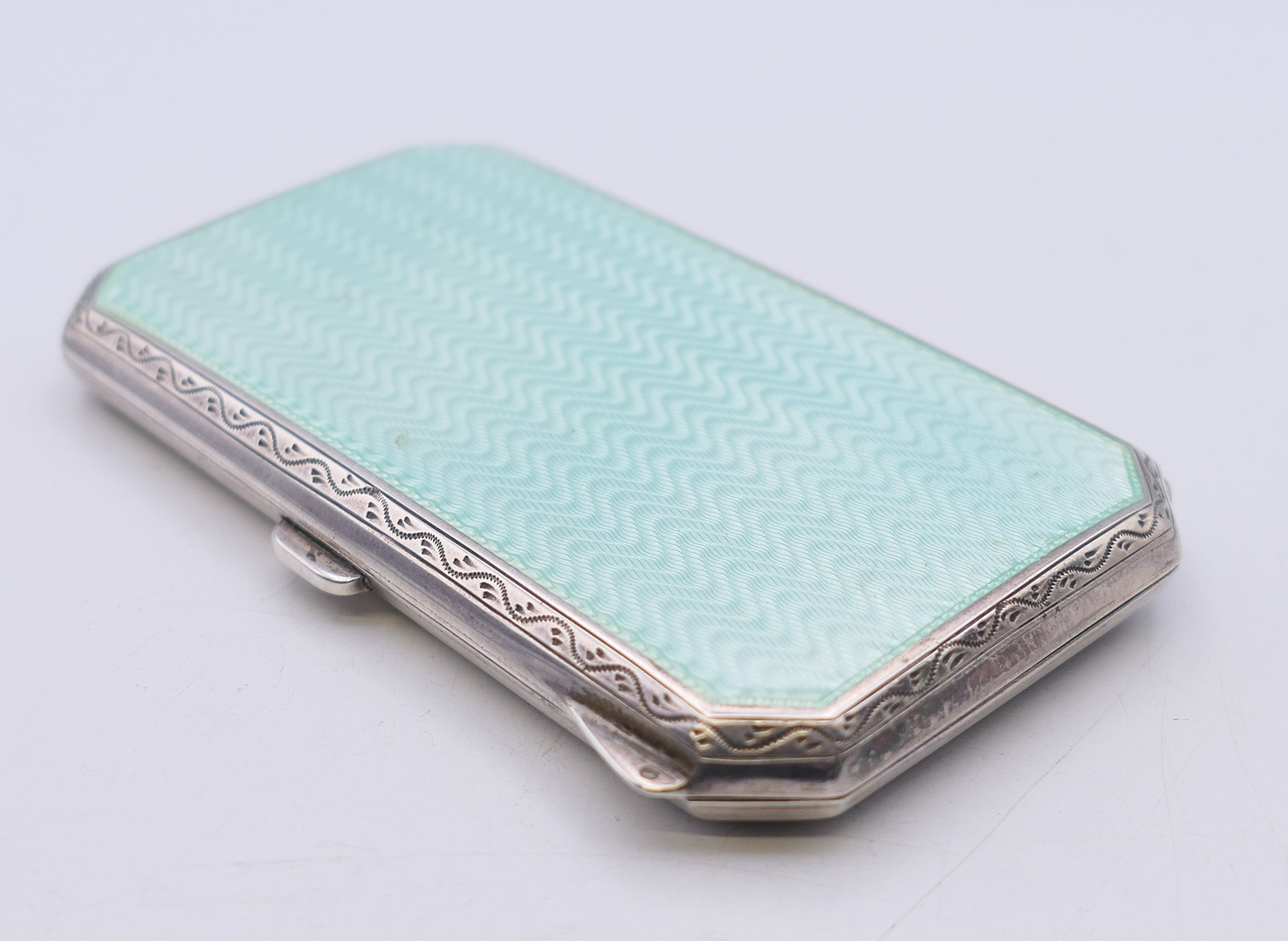 An early 20th century enamel decorated silver cigarette case. 8 cm x 4.5 cm. - Image 2 of 9