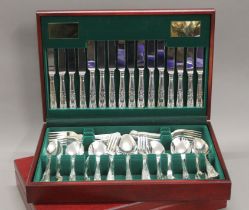 Two cased sets of silver plated Kings pattern cutlery. The cases 44.5 cm wide.