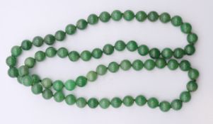 A string of jade beads. 80 cm long.