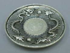 A Chinese coin dish. 10 cm diameter.