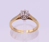 An 18 ct gold diamond solitaire ring. Diamond approximately 0.50 carat. Ring size L/M.