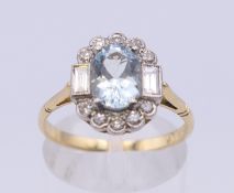 An 18 ct gold oval aquamarine and diamond ring. Ring size P/Q. 3.6 grammes total weight.