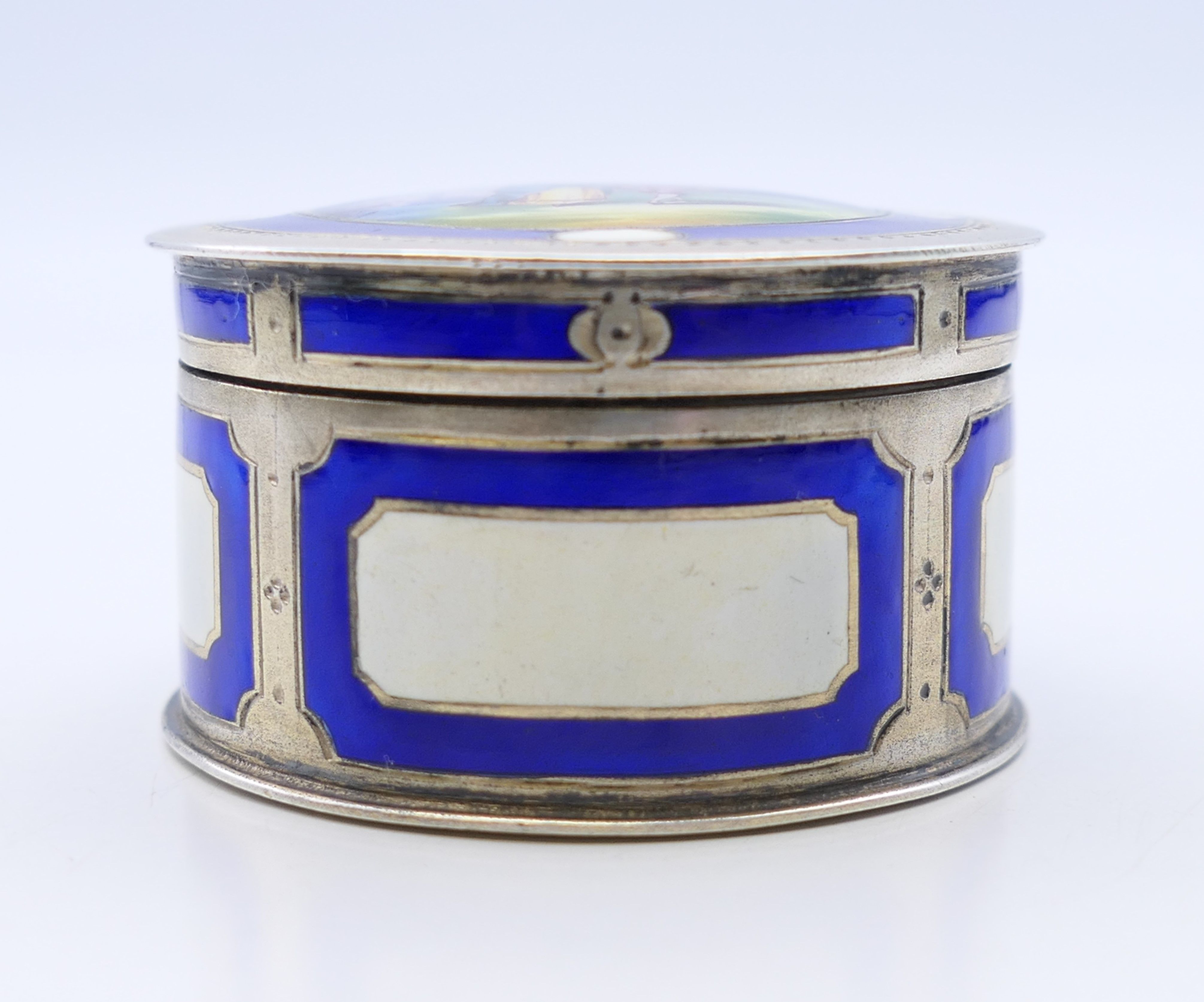 A Continental 800 silver and enamel pill box, the lid decorated with a courting couple. 4. - Image 3 of 8