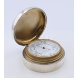 A Mappin and Webb silver cased barometer. 6 cm diameter.