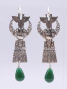 A pair of Egyptian Revival silver earrings. 7 cm high excluding suspension loop.