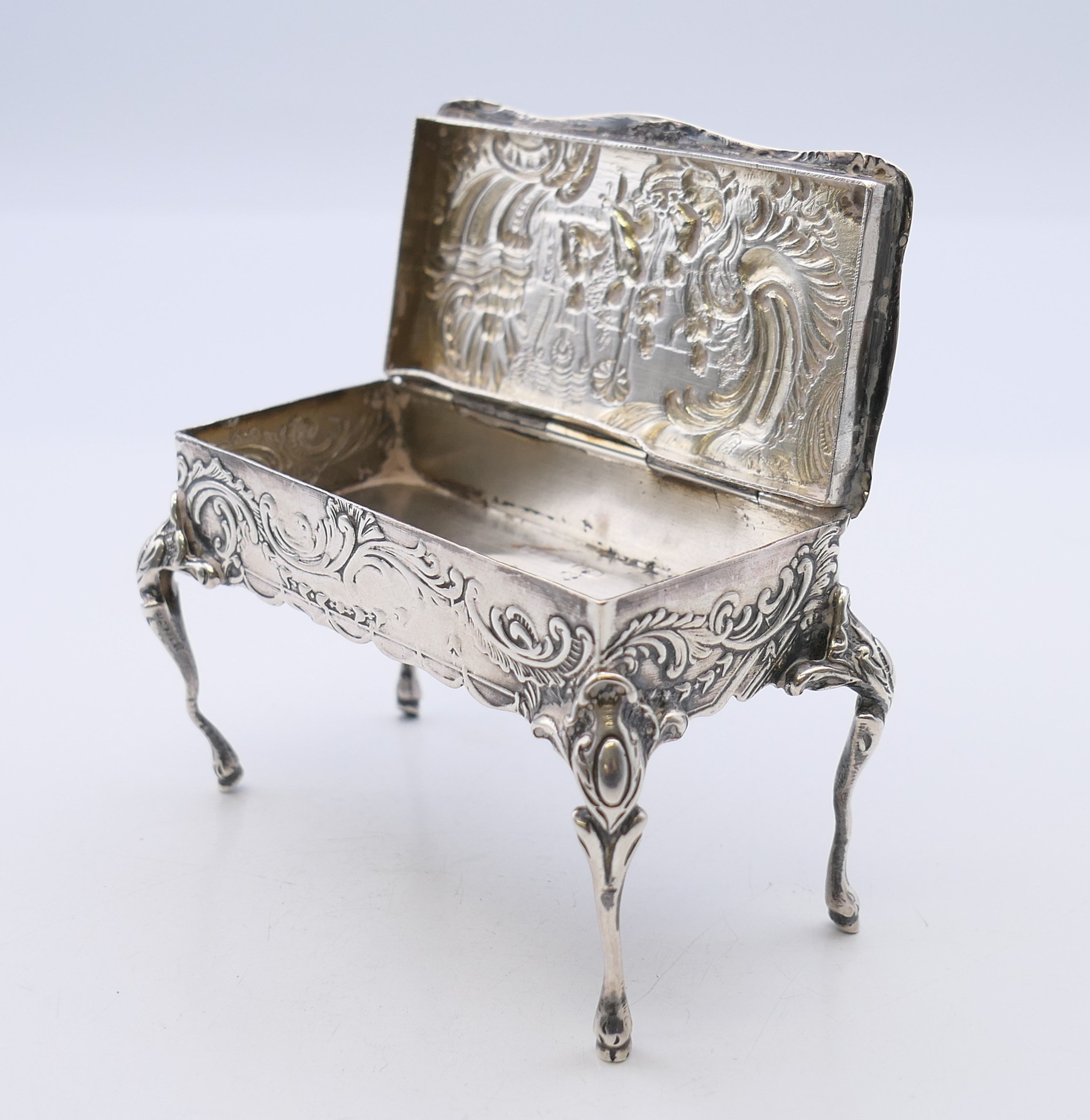 An embossed silver trinket box formed as a table, import marks for London 1899. - Image 7 of 11