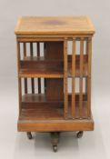 A Victorian mahogany revolving bookcase. 49.5 cm squared.