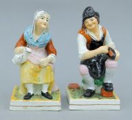A pair of Staffordshire pottery figures. The largest 16.5 cm high.