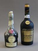 A bottle of De Valcourt VSOP Napoleon Finest French Brandy and a bottle of Benedictine.