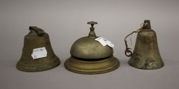 Three Victorian brass bells. The largest 7 cm high.
