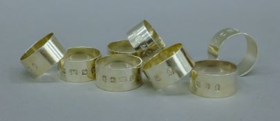 A set of eight silver napkin rings. 252.6 grammes.