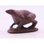 A carving of a frog. 3.5 cm high.