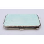 An early 20th century enamel decorated silver cigarette case. 8 cm x 4.5 cm.
