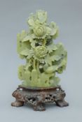 A soapstone carving of flowers. 22.5 cm high.