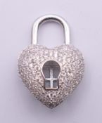 A silver and cubic zirconia heart shaped pendant. 2.5 cm high.