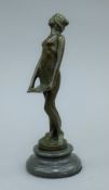 An Art Nouveau style bronze model of a girl on a plinth base. 18.5 cm high.