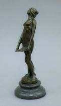 An Art Nouveau style bronze model of a girl on a plinth base. 18.5 cm high.