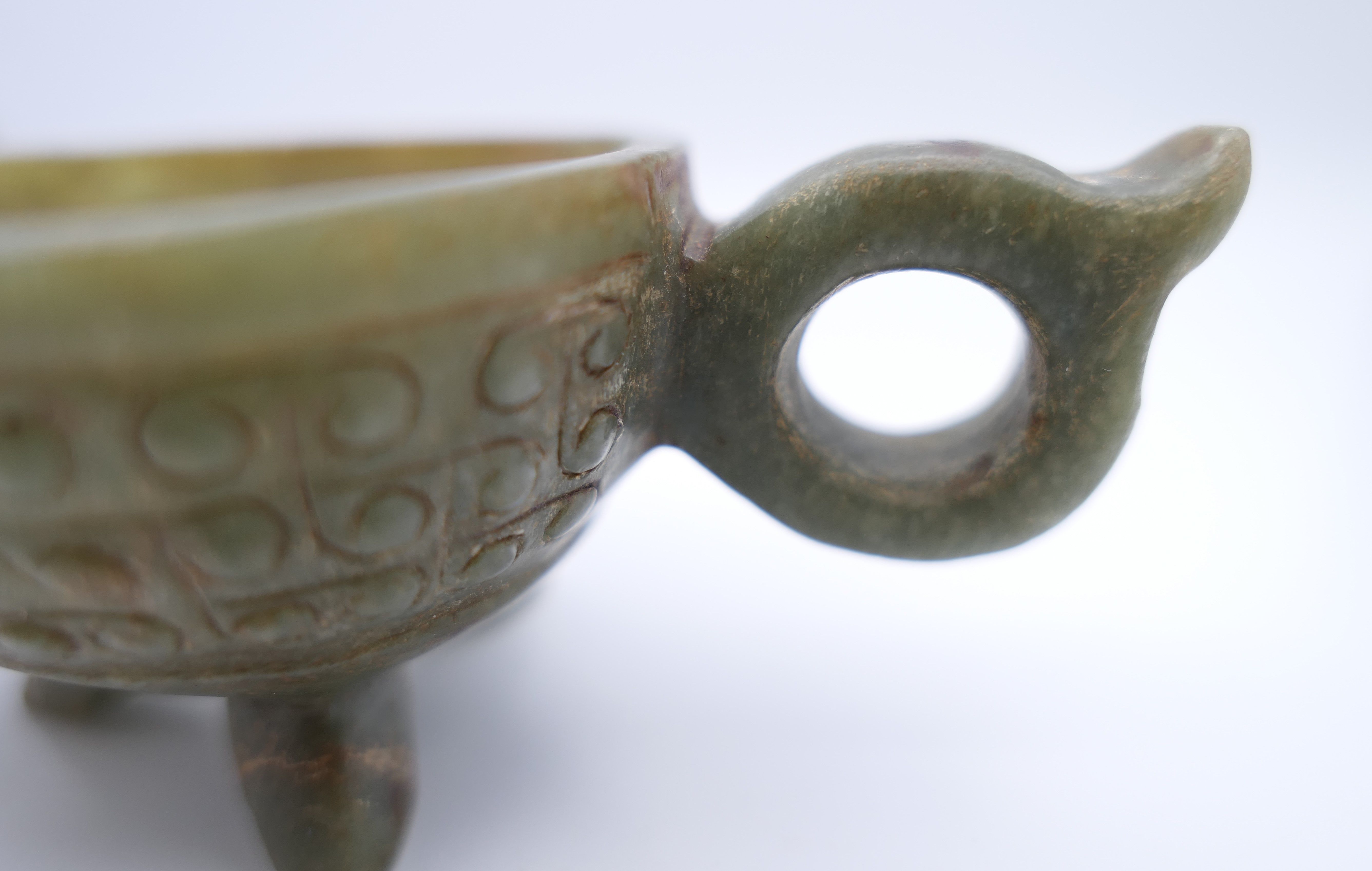 A Chinese green jade ceremonial wine cup, Eastern Han. 14 cm long. - Image 6 of 12