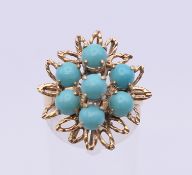 An 18 K gold and turquoise ring. Ring size N/O. 5 grammes total weight.