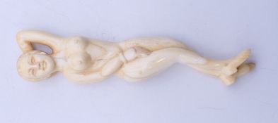 A bone medical figure. 13 cm long.