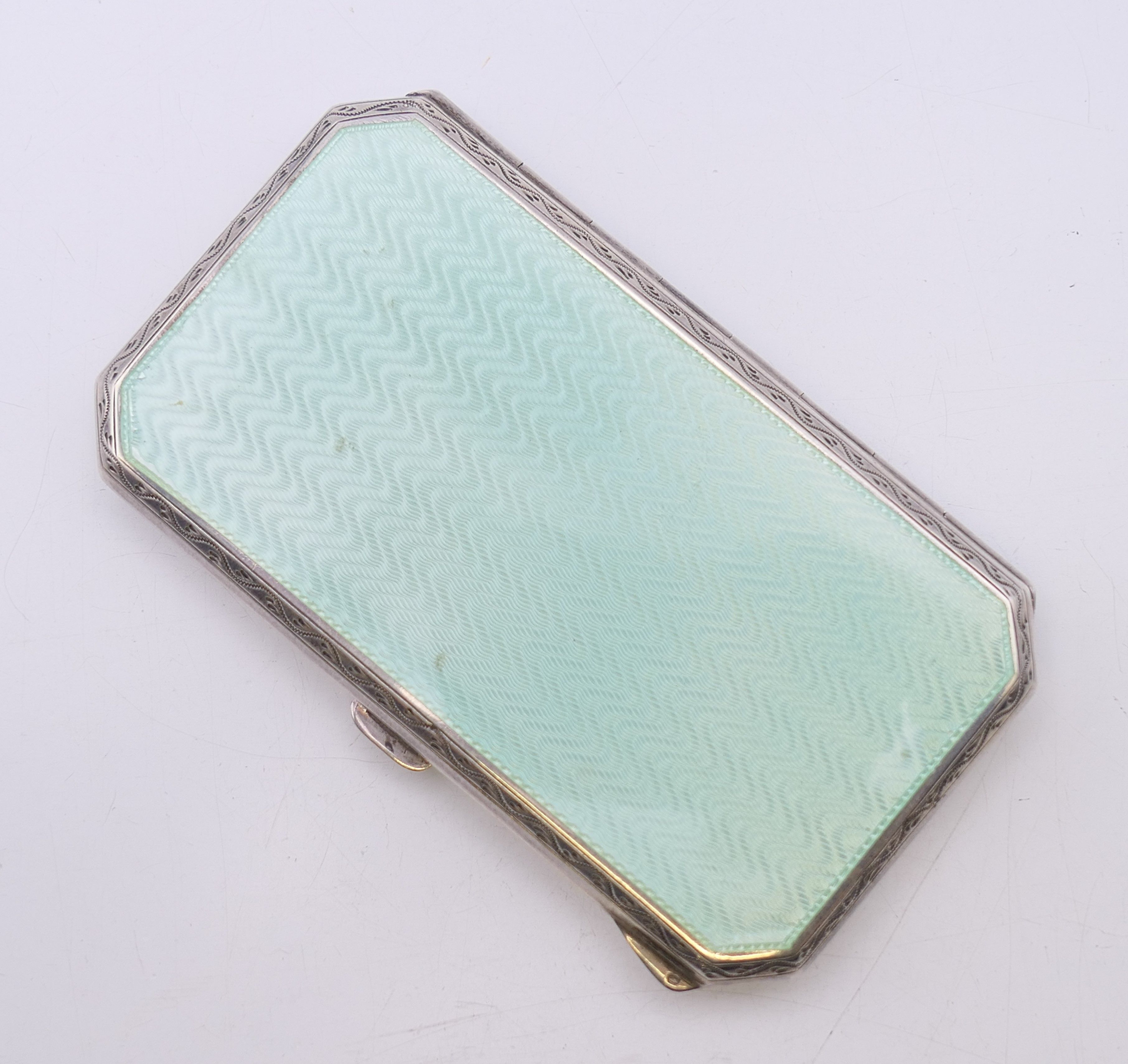 An early 20th century enamel decorated silver cigarette case. 8 cm x 4.5 cm. - Image 3 of 9