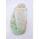 A Chinese light green jade phoenix, Qing Dynasty. 11 cm high.