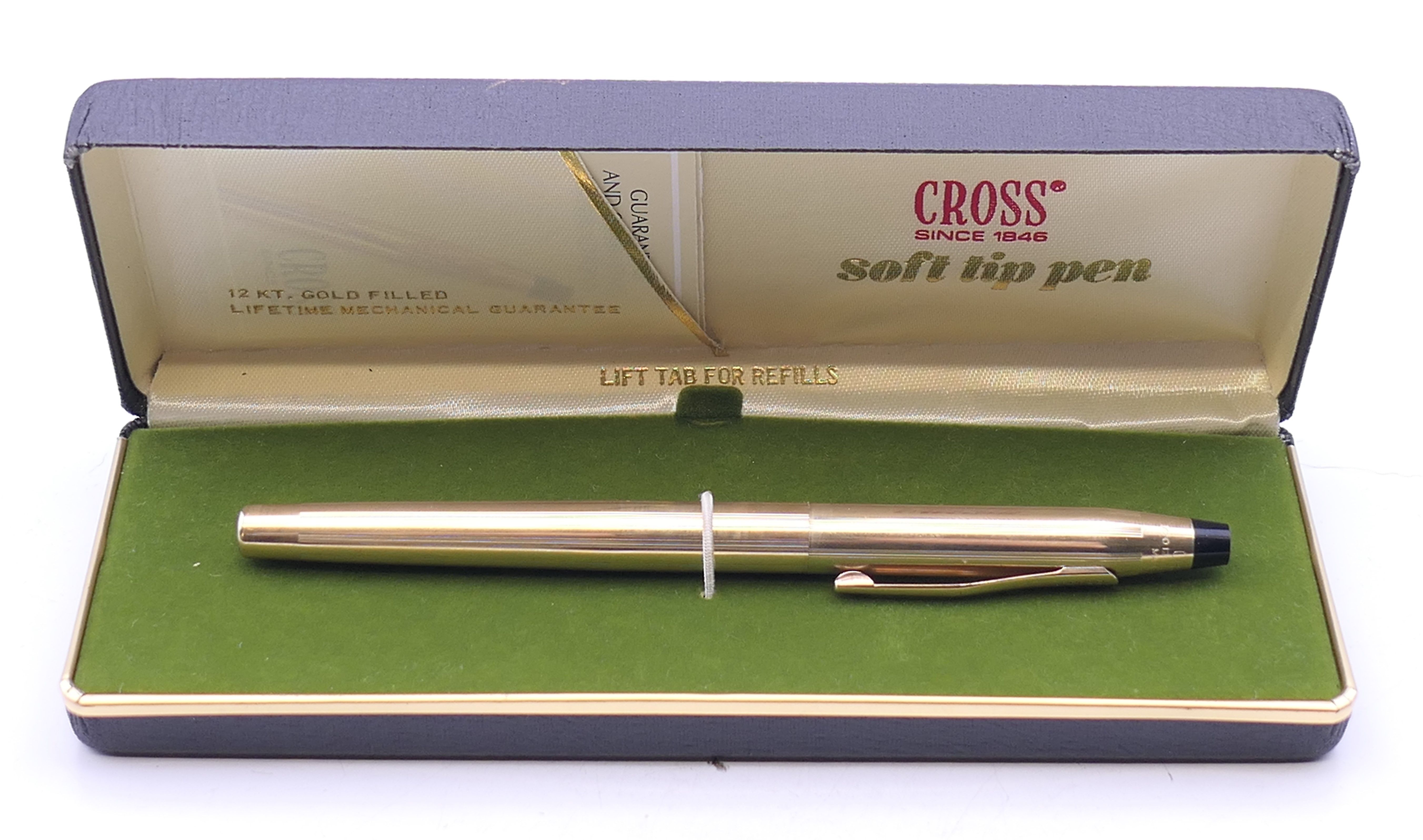 A boxed Cross soft tip pen.