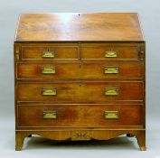 A George III mahogany bureau. 101.5 cm wide.