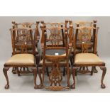 A set of ten Chippendale style dining chairs. 55 cm wide.