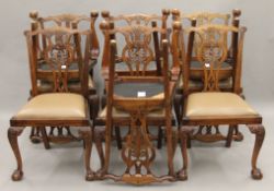 A set of ten Chippendale style dining chairs. 55 cm wide.