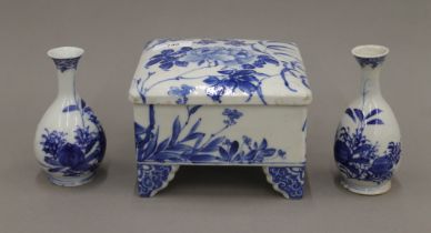 A 19th century Japanese blue and white porcelain box and a pair of small Japanese blue and white