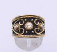 A silver ring, marked GKIKAS. Ring size P.