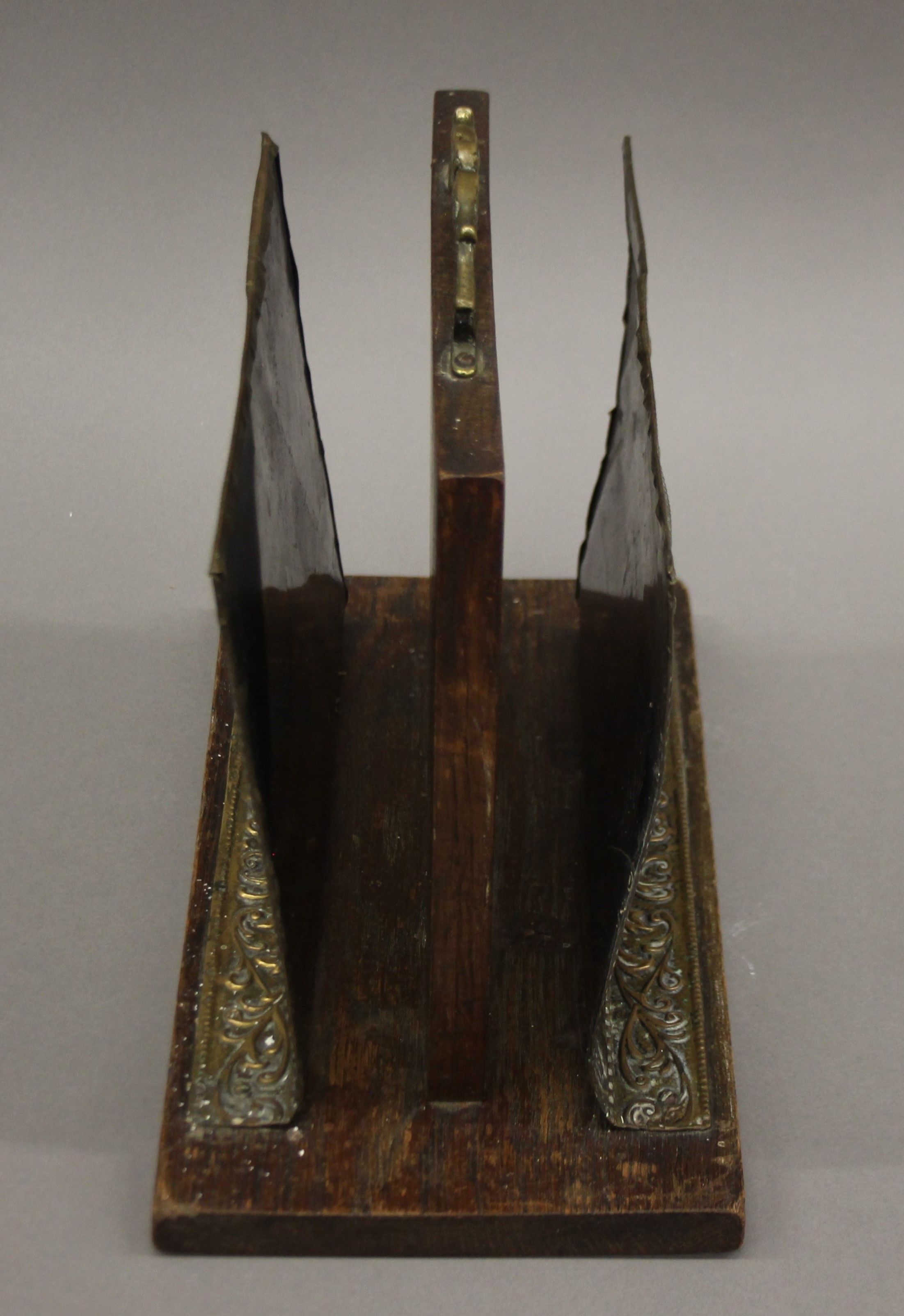 An early 20th century oak and brass magazine stand. 26.5 cm high. - Image 3 of 5
