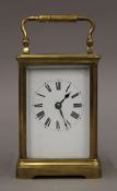 A brass cased carriage clock. 15.5 cm high.