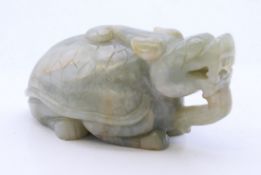 A carved jade dog-of-fo. 9.5 cm long.