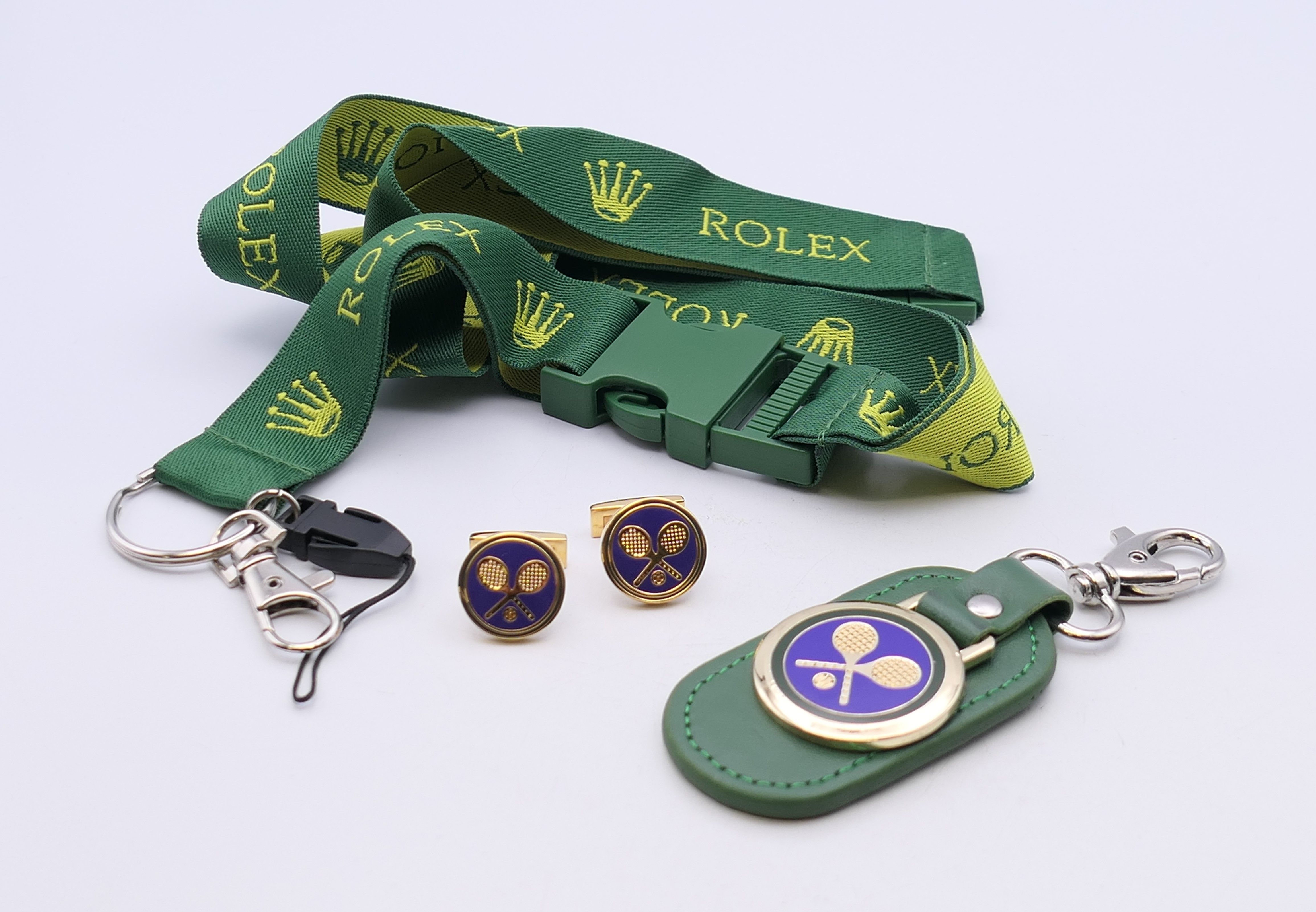 A boxed set of Wimbledon/Rolex cufflinks and keyring, and a Rolex lanyard ID holder. Cufflinks 1.