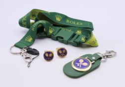 A boxed set of Wimbledon/Rolex cufflinks and keyring, and a Rolex lanyard ID holder. Cufflinks 1.