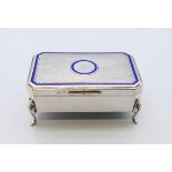 An enamel decorated silver trinket box, hallmarked for Birmingham 1913. 4 cm high, 8.5 cm wide, 5.