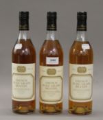 Three bottles of French Pure Grape Brandy. 30 cm high.