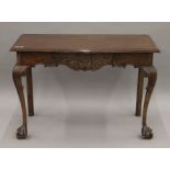 An 18th century style serpentine side table. 106 cm wide.