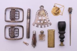 A box of various items, including buckles, penknife, seal, etc. Buckles 6 cm x 4.5 cm.