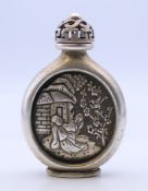 A Chinese white metal snuff bottle. 8.5 cm high.