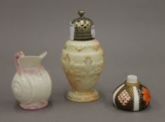 A small Belleek jug, a Worcester sifter and a Derby pot. The former 7 cm high.