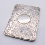 A silver card case, hallmarked for Birmingham 1886. 10 cm x 7 cm. 49.2 grammes.