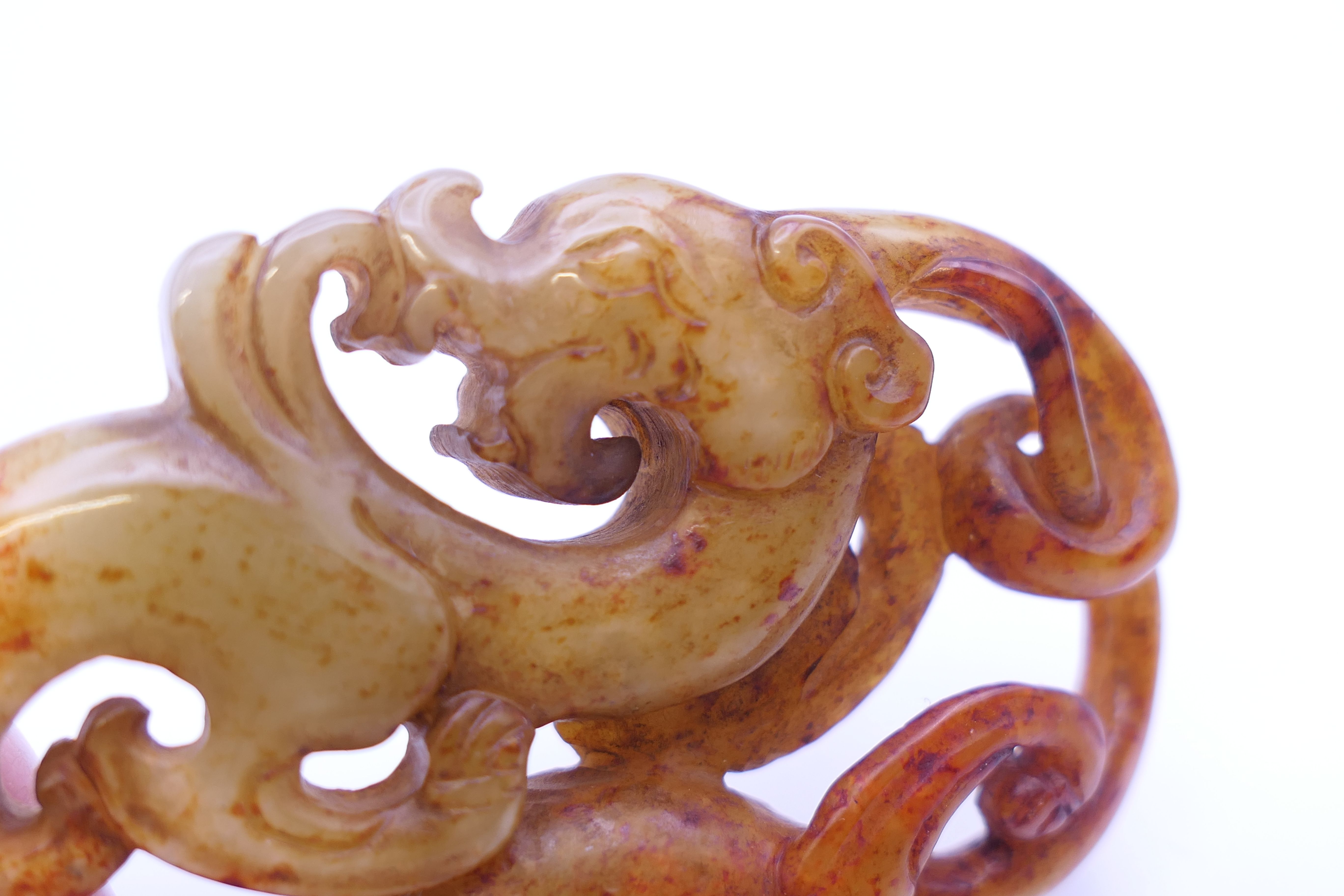 A Chinese white, yellow, green and red jade dragon pendant, Han Dynasty. 7 cm high. - Image 4 of 4