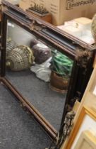 A large bevelled mirror. 117 x 87.5 cm.