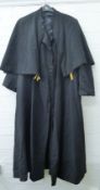 A 1930s black soutane (Clergyman's dress coat).