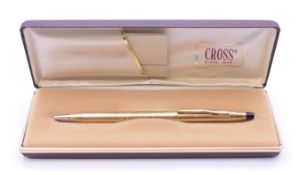 A boxed Cross ballpoint pen.